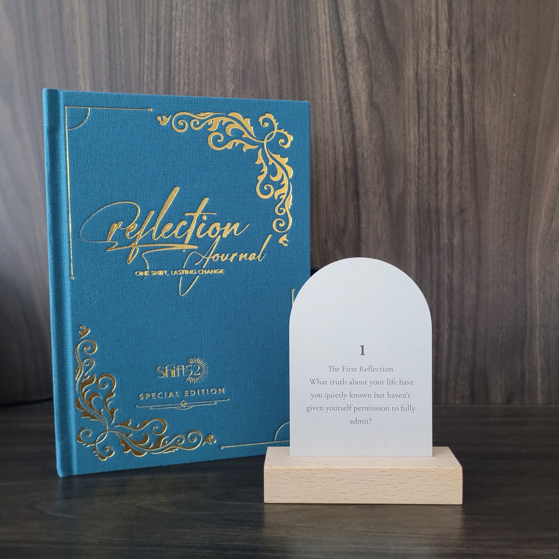 The journal beside a reflection prompt card